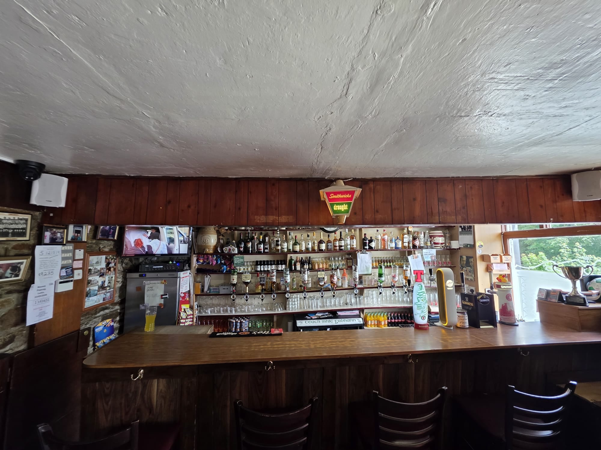 The traditional front bar at McGowan's, wood panelling and stone wall
