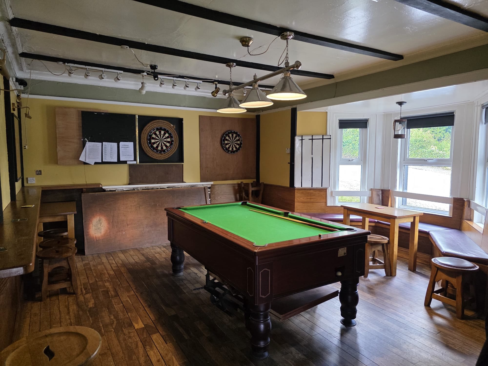 The back games room with pool table and dartboards at McGowan's